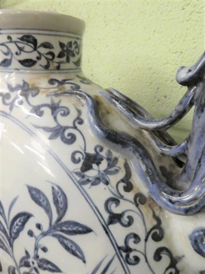 Lot 323 - A large Chinese blue and white moon form ewer, hand painted with parrots, 44cm height