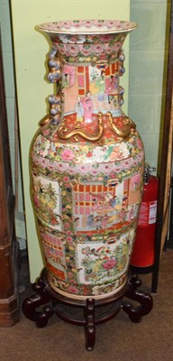 Lot 327 - A modern Chinese floor standing famille rose decorated vase, with hardwood stand