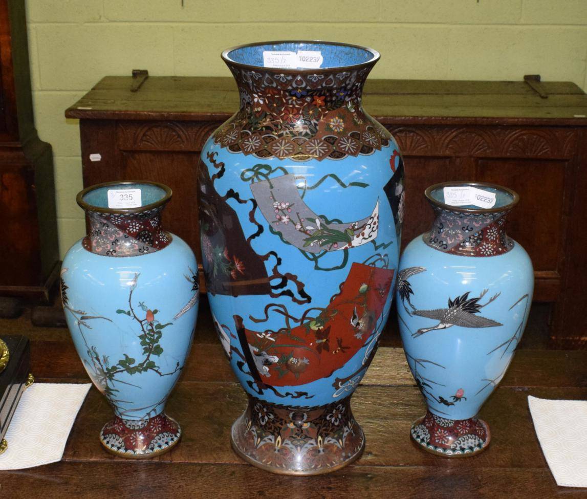 Lot 335 - A pair of Japanese cloisonne vases decorated with cranes; together with a similar larger...