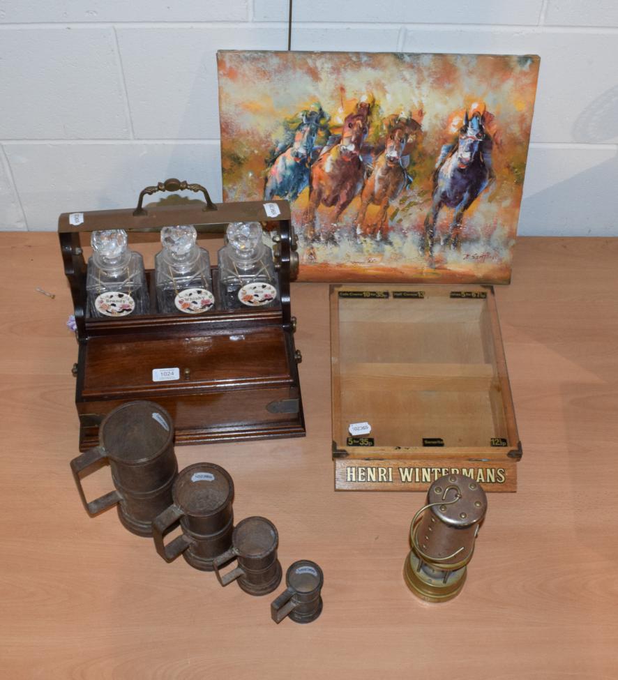Lot 1024 - A modern tantalus, measures Wintermans display case, miners lamp and an oil of racehorses,...