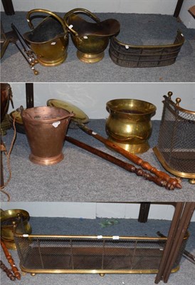 Lot 1052 - Late 19th century brass fire curb with fitted spark guard, a later smaller example, two helmet-form