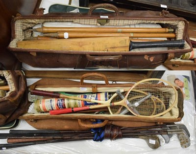 Lot 1071 - A group of vintage sporting equipment including golf clubs; cricket bat and pads; badminton rackets