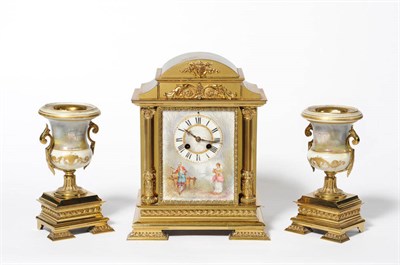 Lot 1354 - A French Brass and Porcelain Mounted Striking Mantel Clock Garniture, circa 1880, the arched...