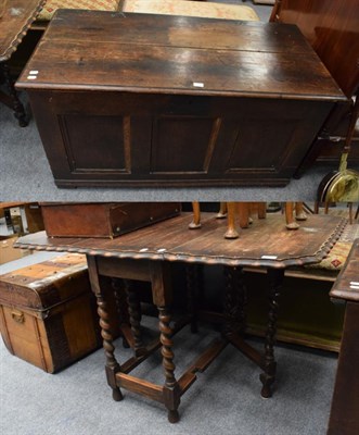 Lot 1213 - A 19th century oak three panel coffer; together with a 1920s oak drop leaf table (2)