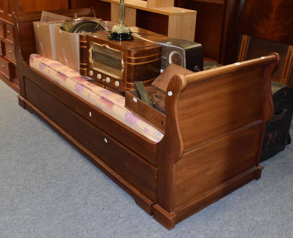 Lot 1226 - A single mahogany sleigh bed with pull out second bed, two mattresses