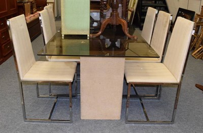 Lot 1229 - Zem & Cie SAS: a 1970/80 smoked glass rectangular dining table, on block supports with mirrored...