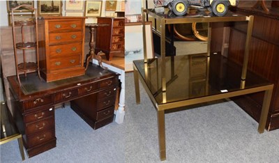 Lot 1233 - A mahogany reproduction pedestal desk; a tripod table; a three-tier cake stand; a small four-height