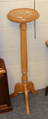Lot 1238 - A Coxwold cabinet makers English oak torchere, on a fluted column and tripod feet, carved...