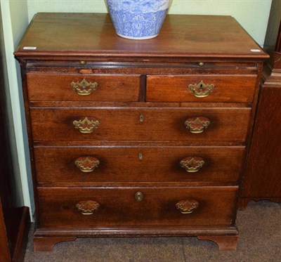 Lot 1255 - A small George III mahogany chest of drawers with slide