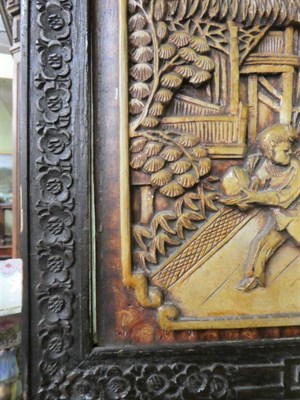 Lot 1263 - A 20th century Chinese heavily carved four-fold screen