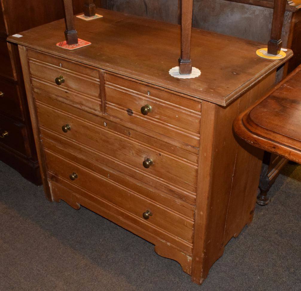 Lot 1284 - An early 20th century three-height pine chest of drawers