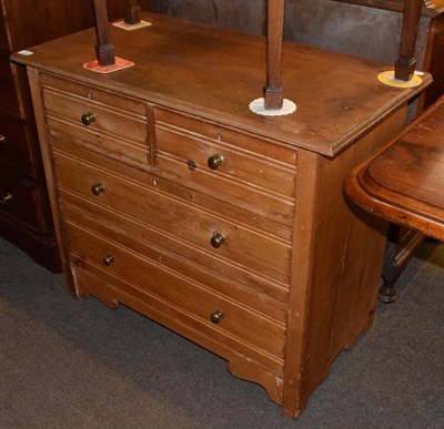 Lot 1284 - An early 20th century three-height pine chest of drawers