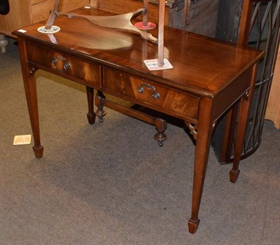 Lot 1288 - A reproduction mahogany two drawer side table