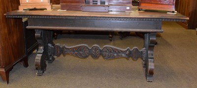 Lot 1310 - A 19th century Italian walnut carved dining table