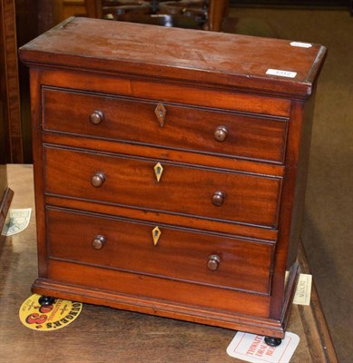 Lot 1312 - A 19th century mahogany three-height miniature chest of drawers