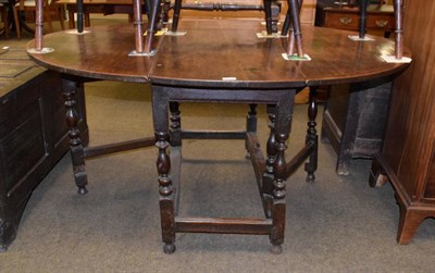 Lot 1315 - A 18th century oak gateleg dining table