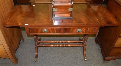Lot 1326 - A reproduction mahogany sofa table fitted with two drawers
