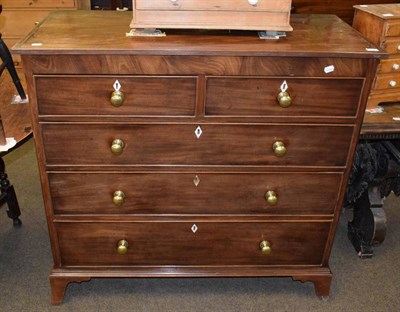 Lot 1327 - A George III mahogany four height chest of drawers with later handles