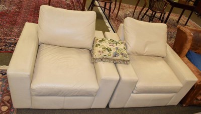 Lot 1328 - Two Multi-York cream leather armchairs