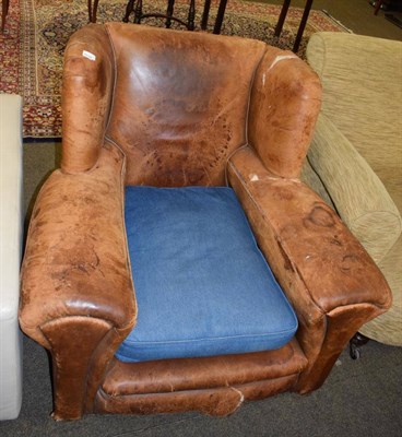 Lot 1329 - A large leather armchair (a.f.)