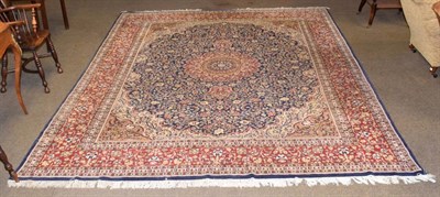 Lot 1338 - An Indian Carpet, with central flower head medallion framed by crimson borders,370cm by 272cm