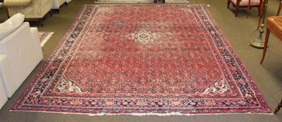 Lot 1339 - Hamadan Rug, Iranian Kurdistan, the strawberry herati field with central medallion framed by indigo