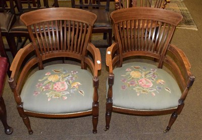 Lot 1346 - Two Edwardian mahogany horseshoe form slat back chairs