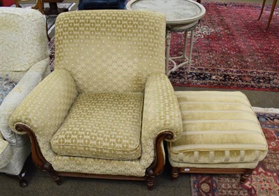 Lot 1355 - A mahogany framed upholstered armchair with similar footstool