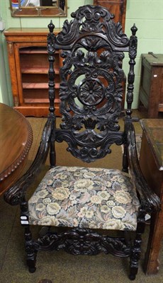 Lot 1361 - An early 20th century carved oak hall chair in the Carolean taste