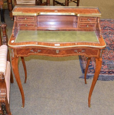 Lot 1366 - A reproduction French Kingwood leather inset ladies writing table