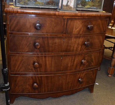Lot 1374 - A 19th century mahogany four-height bow fronted chest