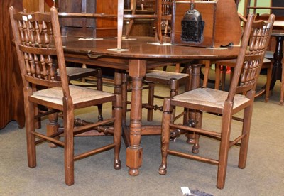 Lot 1376 - A Titchmarsh & Goodwin circular extending dining table, with one additional leaf, on gun barrel...