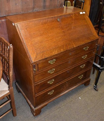 Lot 1378 - A George III oak bureau