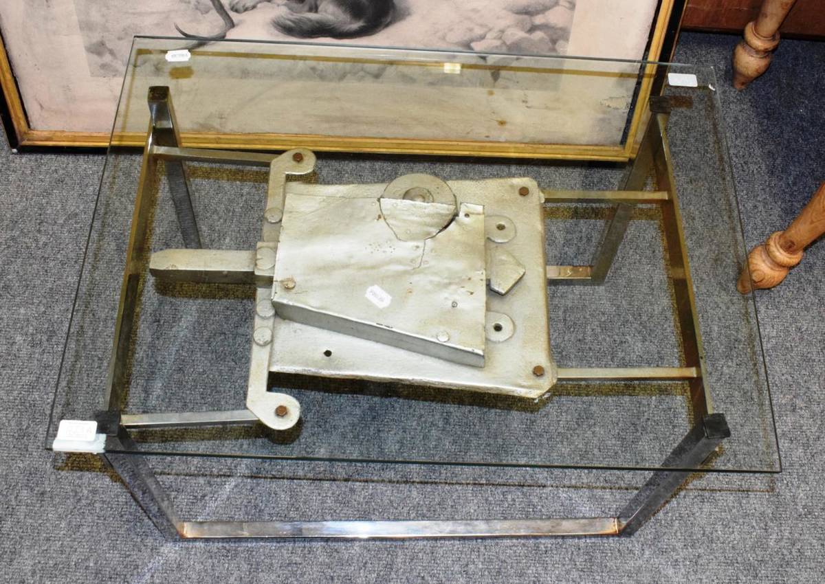 Lot 1229 - An industrial form chromed metal square tubular form coffee table, with plate glass top, the...