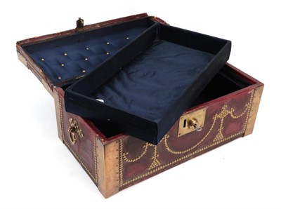 Lot 2003 - 19th Century Brown Leather Mounted Small Trunk with brass mounts, studded decoration, bears a brass