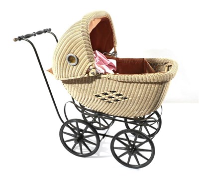 Lot 2005 - Circa 1930s Wicker Stylised Childs Pram, painted cream with circular coloured glass apertures...
