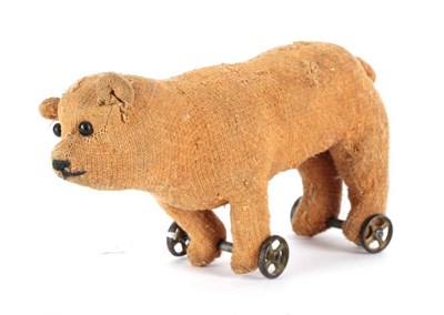 Lot 2012 - Early 20th Century Miniature Bear on Wheels, with boot button eyes, in brown worn plush,...