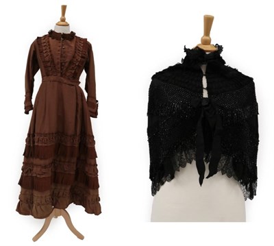 Lot 2116 - Late Victorian Brown Silk Dress with pleated trims to the bodice and skirt; and a Black Silk...
