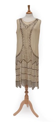 Lot 2122 - Circa 1920's Cream Chiffon Dress, sleeveless with scoop neck and cut out v, embellished with...