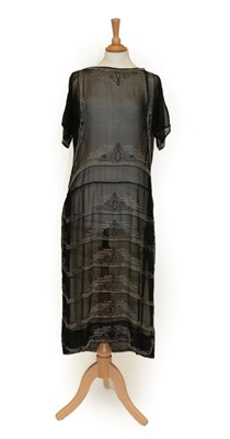 Lot 2123 - Circa 1920s Black Chiffon Dress, with short sleeves, scooped neckline and stripes of beaded...