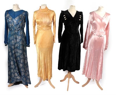 Lot 2137 - Four Circa 1930s Evening Dresses, comprising a blue and silver brocade dress, woven with daisy...