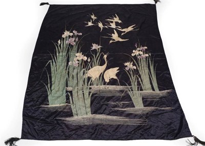 Lot 2244 - An Early 20th Century Chinese Silk Panel/Bed Cover, worked on a dark blue silk ground,...