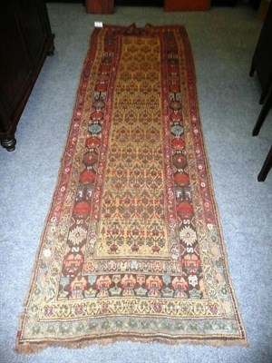 Lot 1416 - North West Persian Runner The field with columns of stylised plants enclosed by borders of...