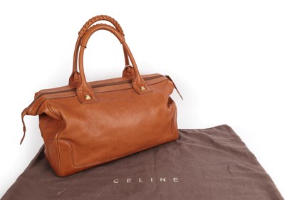 Lot 2275 - Celine Tan Leather Handbag, the two carry handles with laced covers, with large zipped pocket...