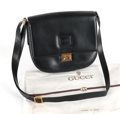 Lot 2285 - Gucci Black Leather Shoulder Bag, with interlocking GG motif to flap closure, gilt metal clasp,...