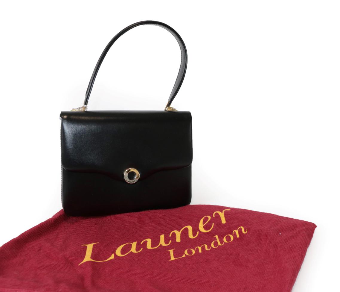 Lot 2288 - Launer Black Leather Small Handbag, with two tone metal fittings and circular clasp closure,...