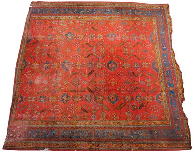 Lot 1421 - Ushak Carpet West Anatolia The soft terracotta field with an allover design of angular vines...