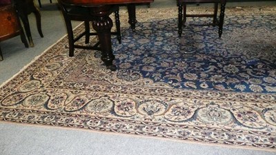 Lot 1426 - Nain Carpet Central Persia The soft indigo field of palmettes and scrolling vines around an...