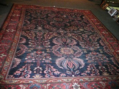 Lot 1427 - Mahal Carpet West Persia The deep indigo field with columns of flowering shrubs enclosed by...