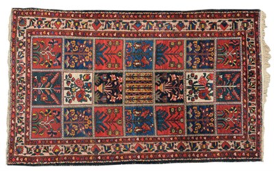 Lot 1439 - Bakhtiari Rug West Persia The polychrome compartmentalised field of flowering plants enclosed...